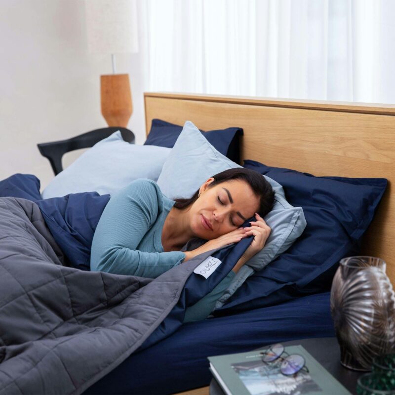 Adult sitting awake at night illustrating insomnia and restlessness during cannabis withdrawal