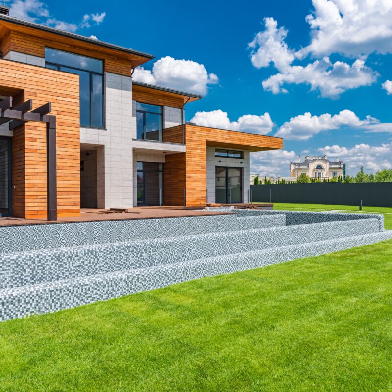 Welcoming residential building with a green courtyard and soft daylight near West Palm Beach
